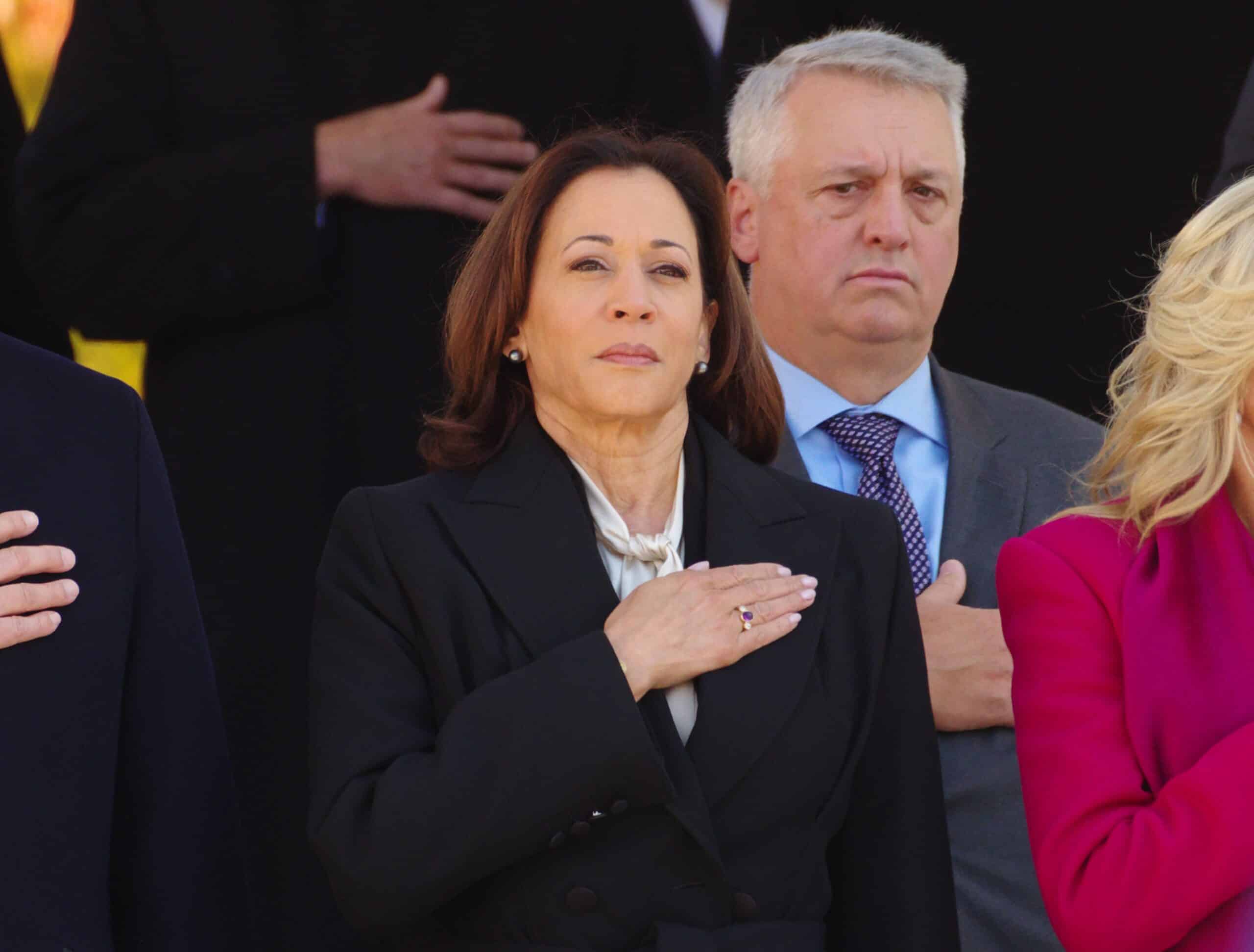 ARLINGTON, VA, USA - November 11, 2023: U.S. Vice President Kamala Harris stands at attention during the playing of the national anthem at a Veterans Day ceremony at Arlington National Cemetery.