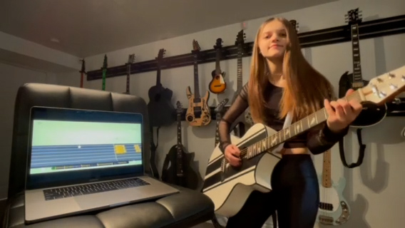 Sierra Levesque on acoustic guitar 